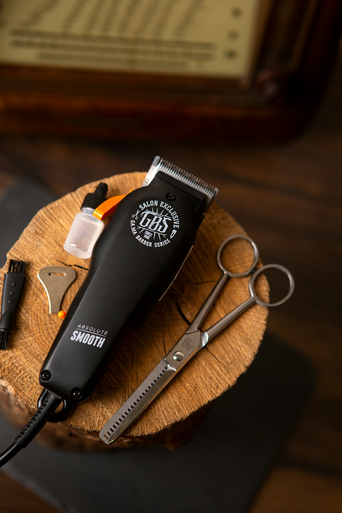A clipper and shears on a wood block at the station